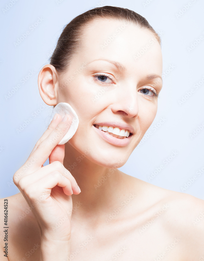 Female cleaning her face. Beauty skin care concept. Female cleaning her face. Beauty skin care concept.