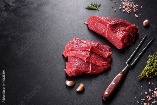 Fresh raw beef meat to make delicious juicy steak with spices and herbs