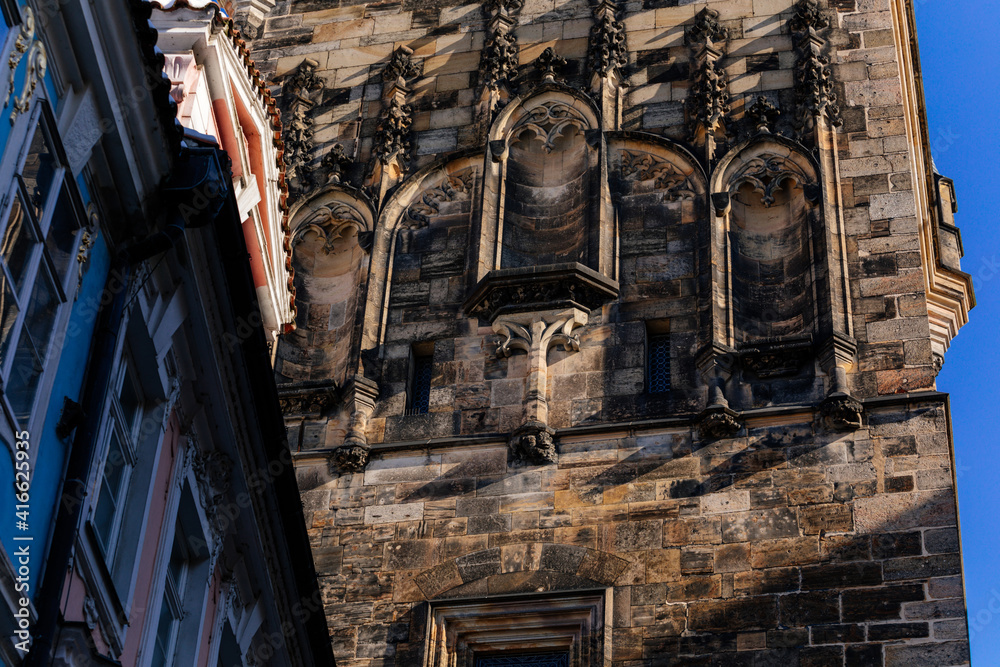 Obraz premium Architectural parts of gothic Charles Bridge tower, Mostecka Street, stone carved art ornament detail, medieval ancient, Mala Strana or Lesser Town district, Prague, Czech Republic