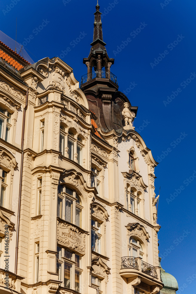 Romantic neo-renaissance stately townhouse, Art Nouveau facade, historical building in old town, most prestigious boulevard Parizska Street at sunny day, Prague, Czech Republic