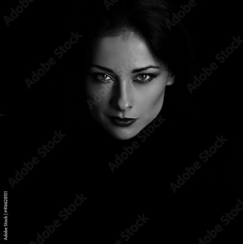 Canvastavla Angry strong look woman with smirking smiling posing isolated on dark shadow black background