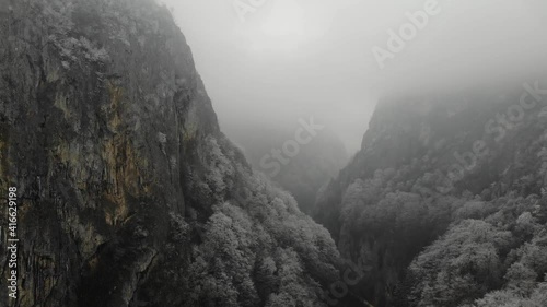 Aerial view approaching the Oltet River Canyon on a winter foggy day photo