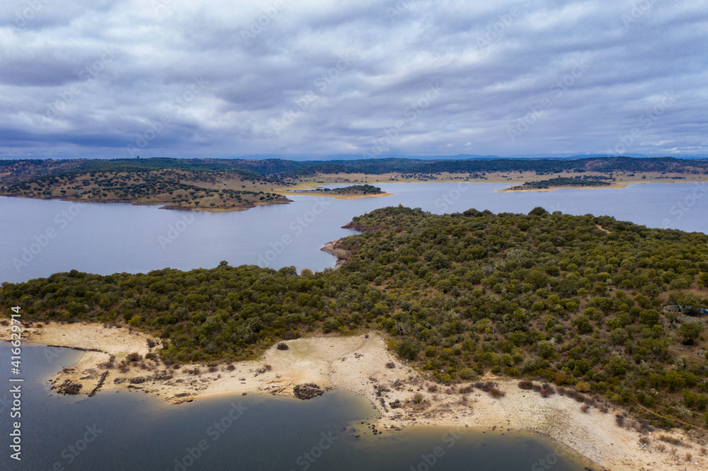 Drone aerial view of Idanha Dam Marechal Carmona landscape with beautiful blue lake water, in Portugal Drone aerial view of Idanha Dam Marechal Carmona landscape with beautiful blue lake water, in Portugal
