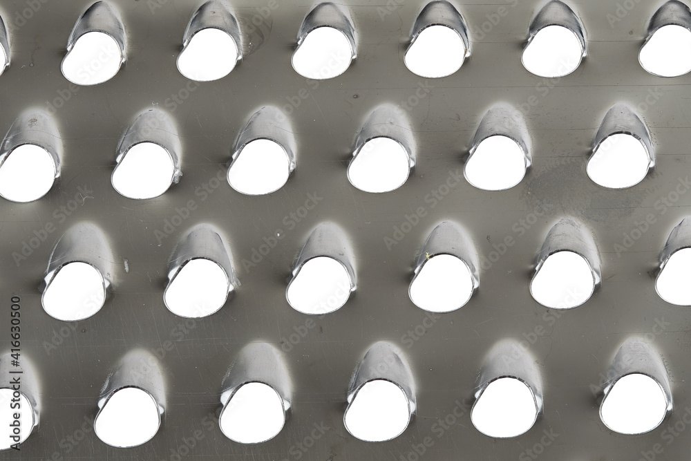 macro image of a cheese grater macro image of a cheese grater