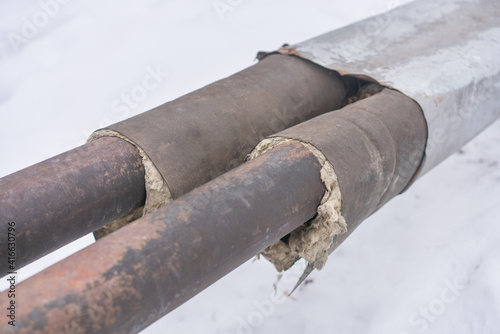 Insulation of old rusty ground heating pipes. Repair of outdated engineering water supply systems.