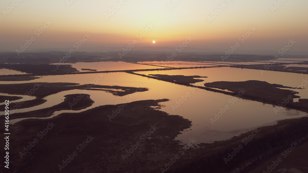 Aerial drone view of Sunset over lake. Beautiful landscape.