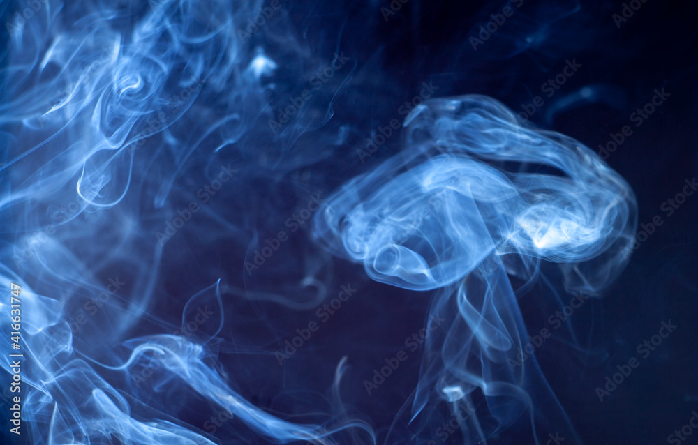 blue jet wave of smoke isolated on black background blue jet wave of smoke isolated on black background