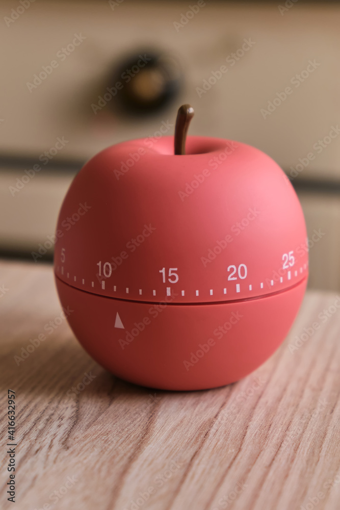 modern kitchen timer apple shaped on the background of the kitchen Stock  Photo | Adobe Stock