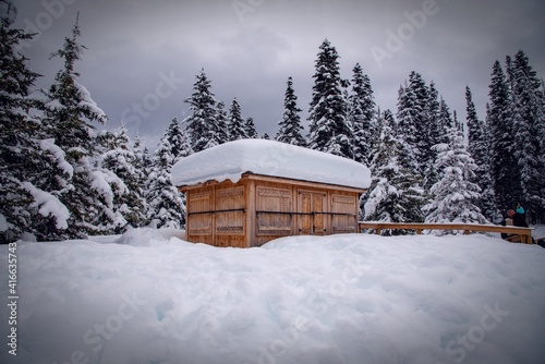 A house or a cabin covered in snow near lake Louise. The Canadian winter wonderland in Banff National park.  © Akshay - PhotOvation