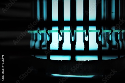 Blue glowing bug zapper closeup