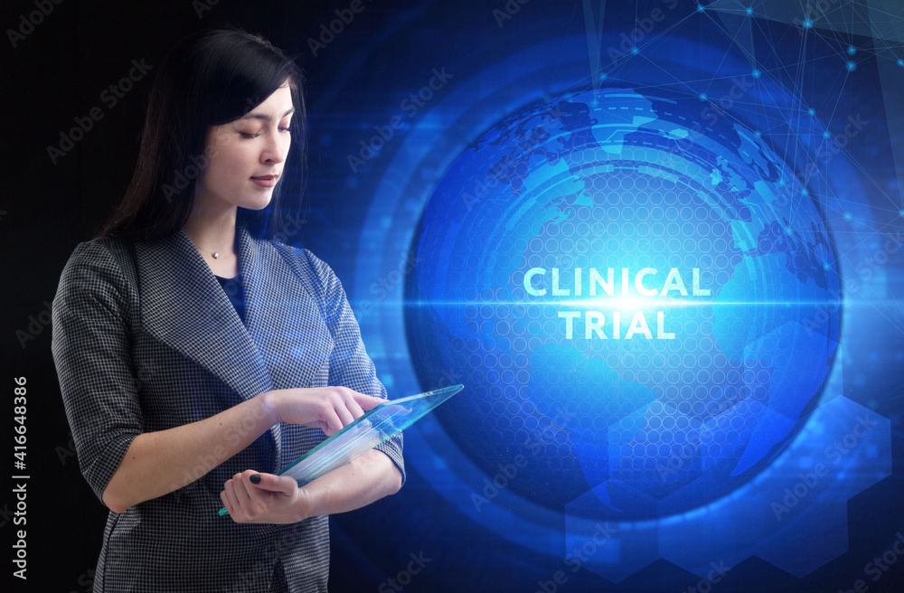 Business, Technology, Internet and network concept. Young businessman working on a virtual screen of the future and sees the inscription: Clinical trial Business, Technology, Internet and network concept. Young businessman working on a virtual screen of the future and sees the inscription: Clinical trial