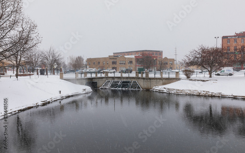 Kalamazoo, Michigan, USA - February 5 2021: Downtown Kalamazoo in snow. view from Arcadia Creek playground. © Daniel