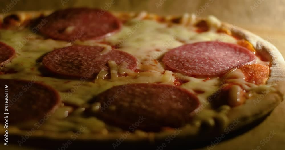 Delicious frozen salami Italian pizza is bake in the home oven in time lapse Delicious frozen salami Italian pizza is bake in the home oven in time lapse