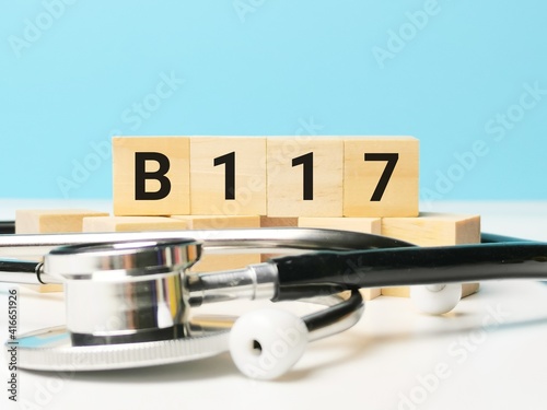 Phrase B117 written on wooden cubes with stethoscope. Medical and health concept. photo