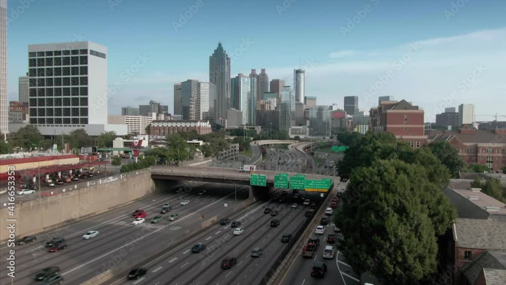 Aerial: Atlanta city skyline and freeway traffic. Georgia, USA Aerial: Atlanta city skyline and freeway traffic. Georgia, USA
