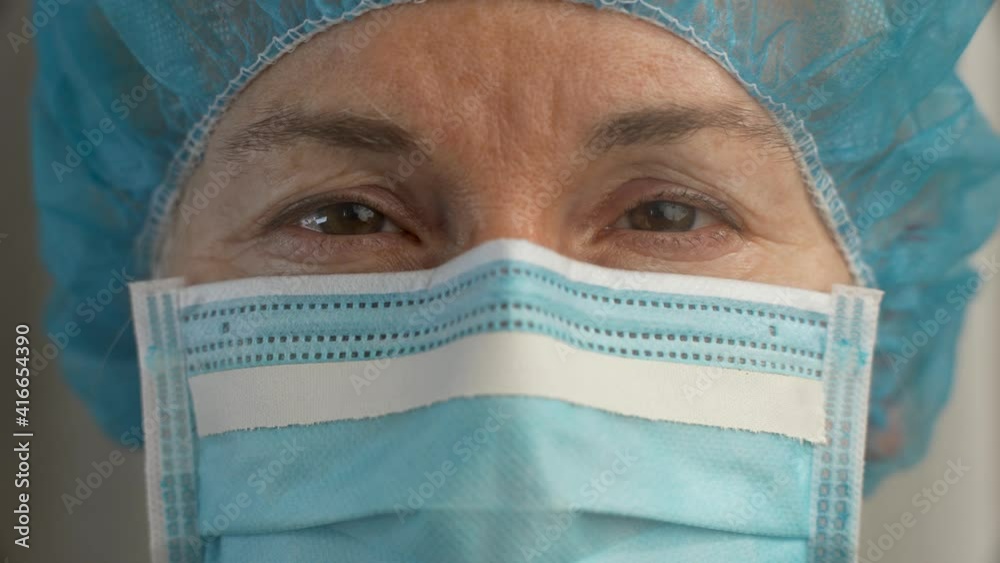 Sad and tired medic opens eyes and looking atraight at camera. Medical nurse portrait closeup. Concept exhausted health care worker. Sad and tired medic opens eyes and looking atraight at camera. Medical nurse portrait closeup. Concept exhausted health care worker.