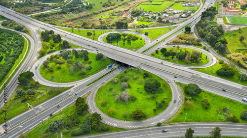 Drone view of cloverleaf interchange. Aerial view of highway road junction. Highway road in Portugal, Almada