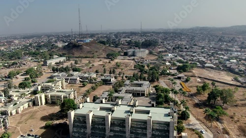 The Nigerian town of Jos on a hazy day - aerial pull back view photo