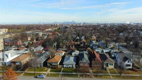 Descending View of Houses in the Suburbs and Chicago Skyline in the Background