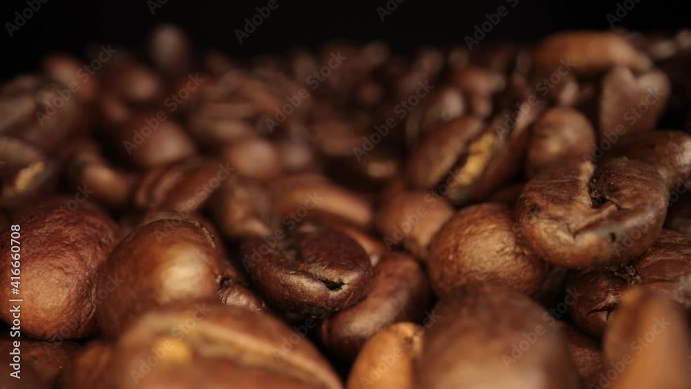 Freshly roasted Coffee Beans - sliding macro shot Freshly roasted Coffee Beans - sliding macro shot
