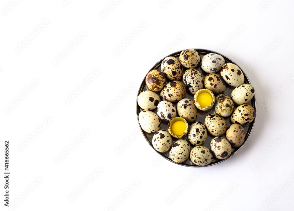 Quail eggs in a box on a white background. Minimalistic concept for Easter card Quail eggs in a box on a white background. Minimalistic concept for Easter card