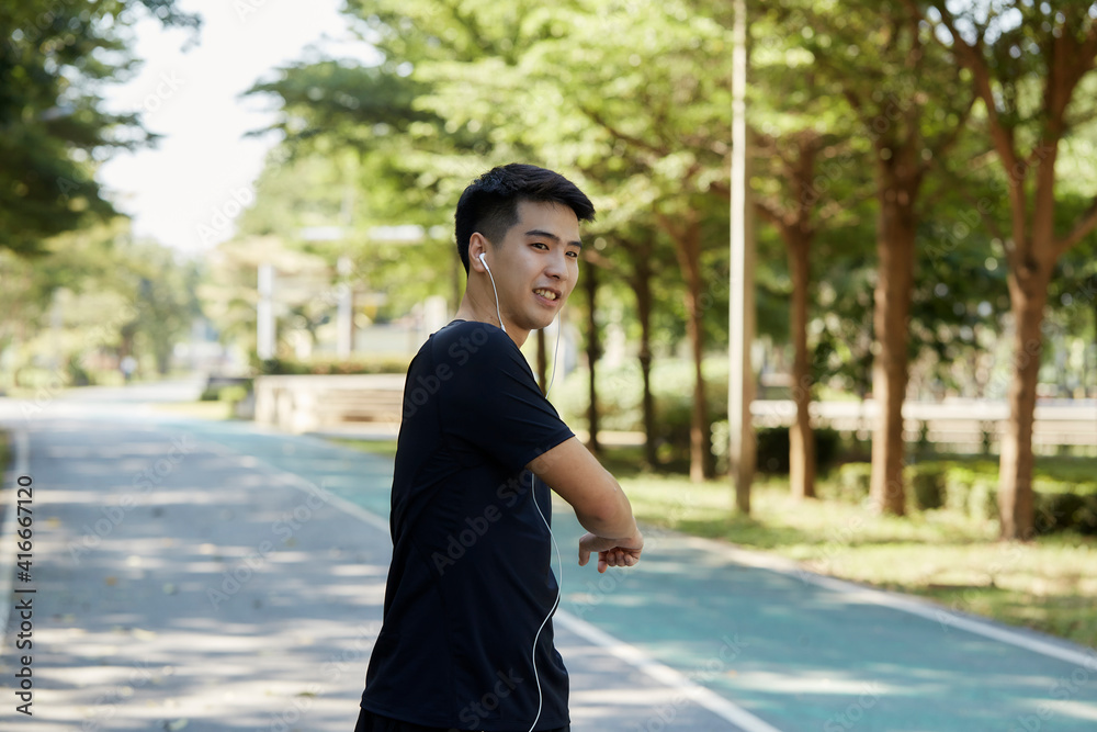 A young man walks outdoor as workout A young man walks outdoor as workout