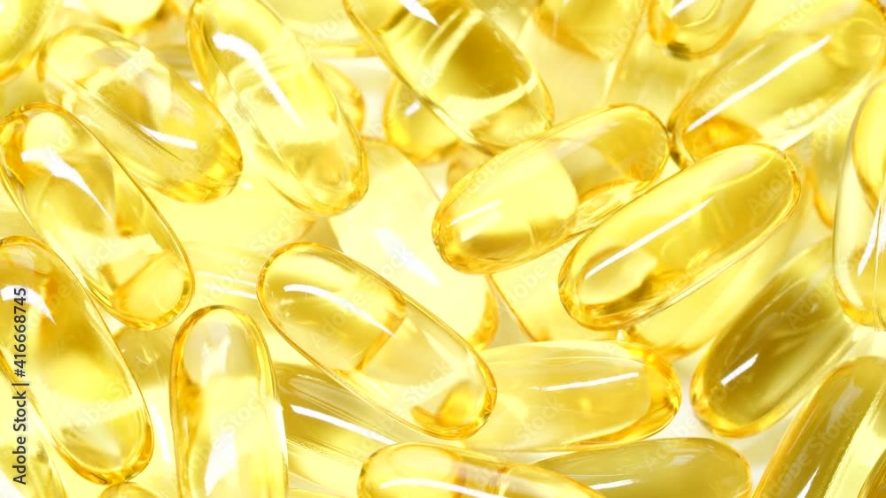 4K closeup Omega 3 fish oil pills background, vitamin E natural capsules texture 4K closeup Omega 3 fish oil pills background, vitamin E natural capsules texture