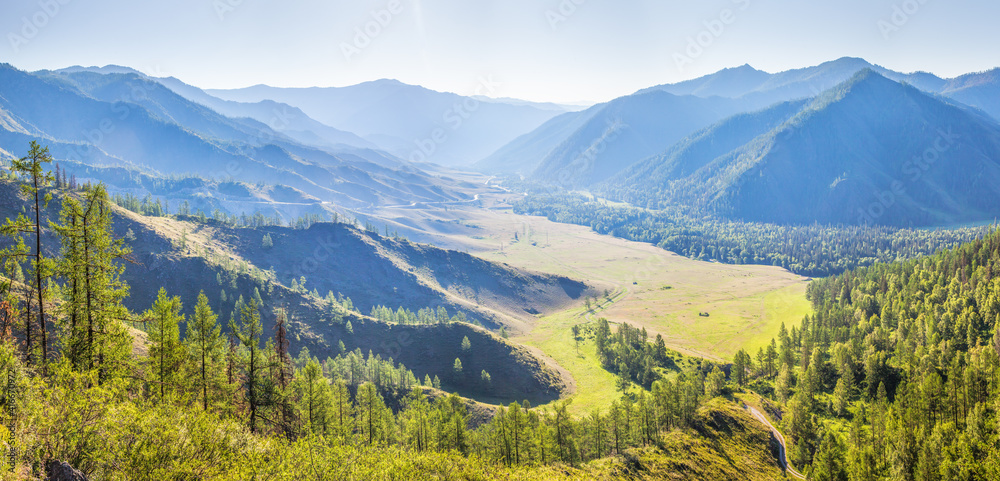 Panoramic view of the Altai Mountains, a picturesque valley on a summer sunny day	