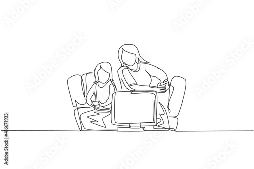 One continuous line drawing of young mother and daughter sitting on sofa while playing video game together at home. Happy family parenthood concept. Dynamic single line draw design vector illustration