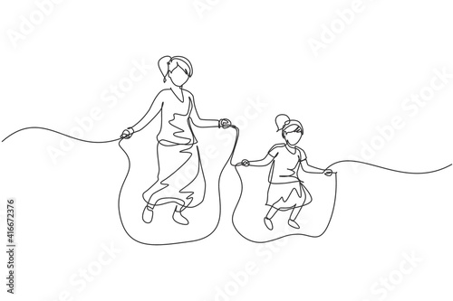 One continuous line drawing of young mom and her daughter exercise jumping with skipping rope at park near home. Happy family parenting concept. Dynamic single line draw design vector illustration