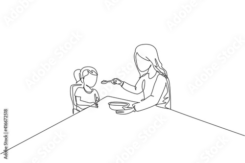 Single continuous line drawing of young mother feeding her sick fever daughter while siting on dining chair at home. Happy family parenthood concept. Trendy one line draw design vector illustration