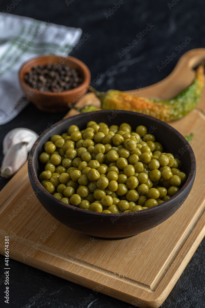 Vertical photo of marinated olives on wooden board Vertical photo of marinated olives on wooden board