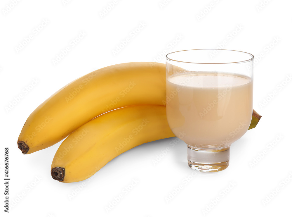 Glass with tasty banana juice on white background