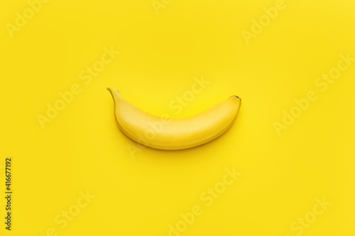 Tasty ripe banana on color background