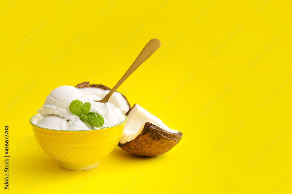 Bowl with tasty coconut ice cream on color background Bowl with tasty coconut ice cream on color background