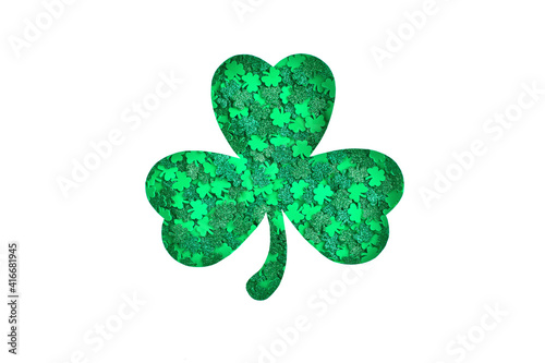 Shamrock silhouette filled with green clovers confetti texture on a white background. Happy St. Patrick's Day Symbol. Spring 17 march lucky clover symbol