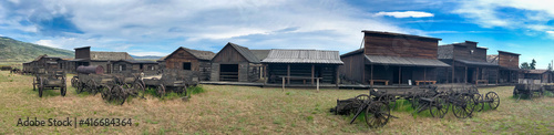 Cody, Wyoming. Wooden barracks of the Old Wild West on a summer day - Panoramic view photo