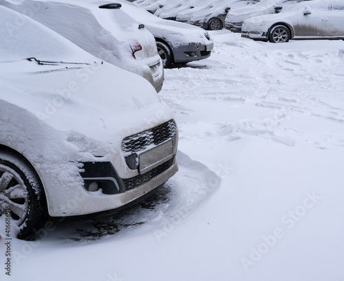 cars covered with snow after heavy snowfall
