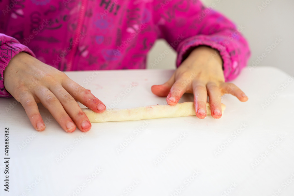 chef rolls cherries into dough for sweet pie, horizontal chef rolls cherries into dough for sweet pie, horizontal