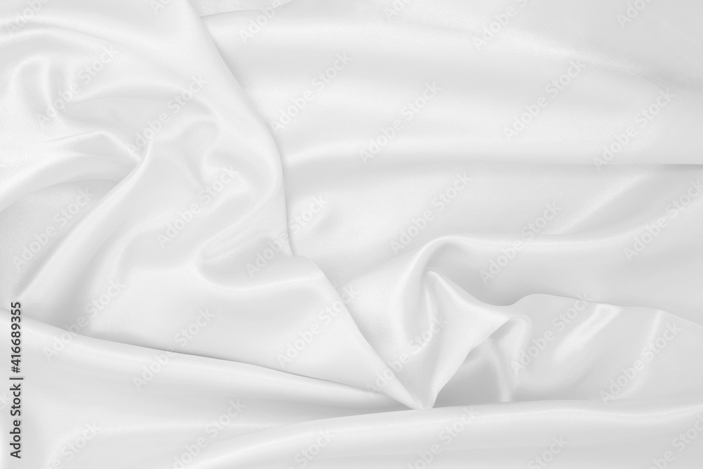 Obraz premium Smooth elegant white silk or satin luxury cloth texture as wedding background. Luxurious background design