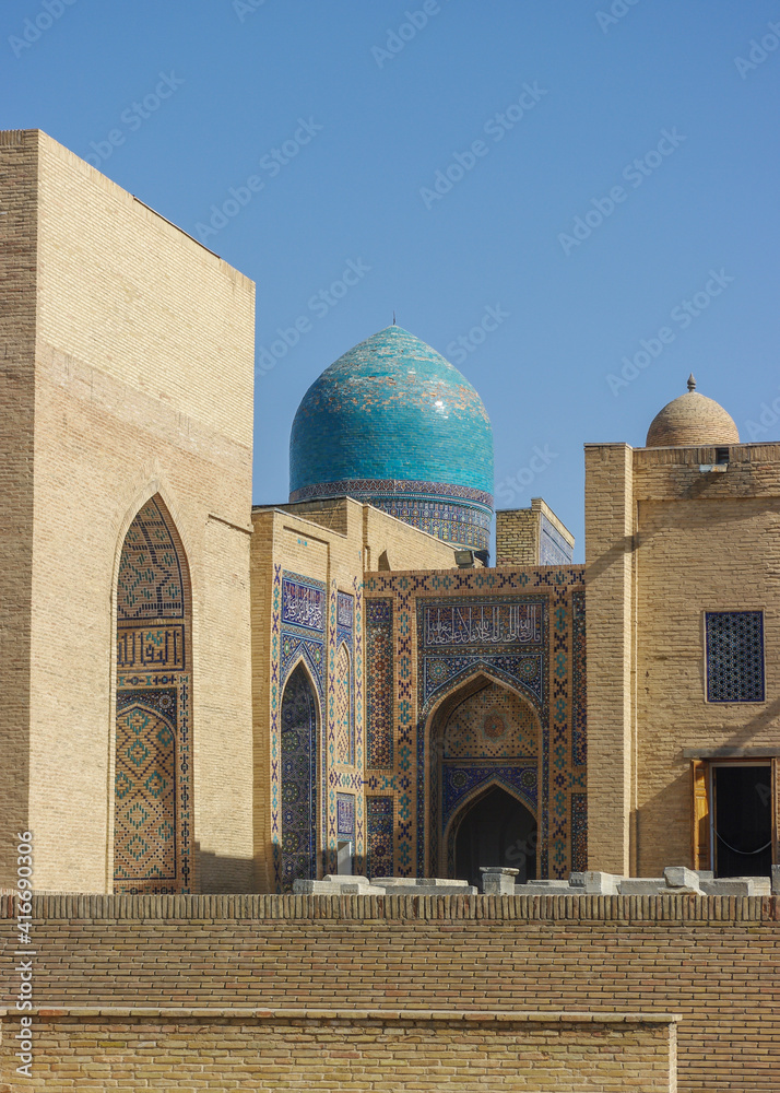 Vertical view of beautiful medieval mausoleums and blue tile dome at Shah-i-Zinda necropolis in UNESCO listed Samarkand, Uzbekistan