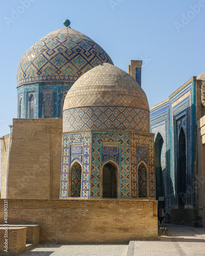 View of beautiful medieval mausoleums with blue tile decoration at Shah-i-Zinda necropolis in UNESCO listed Samarkand, Uzbekistan