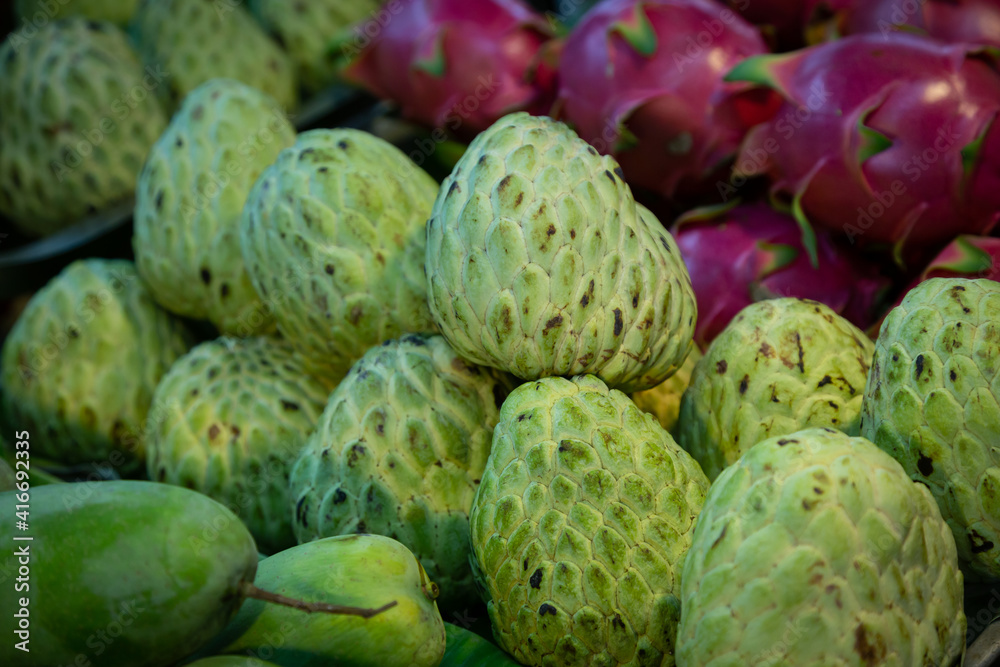 Fototapeta premium Piles of custard apple sold in the market.