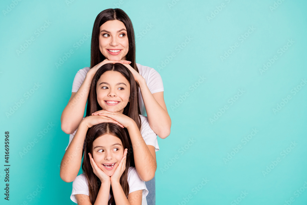 Stockfoto med beskrivningen Photo portrait of three sisters different  generations smiling looking blank space funny isolated vivid blue color  background | Adobe Stock