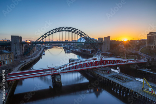 The bridges between Gateshead and Newcastle-upon-Tyne on the River Tyne with a stunning sunrise.