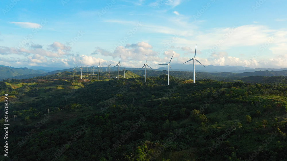 Aerial view of wind turbines and wind mills for electric power production in the Philippines, Luzon.