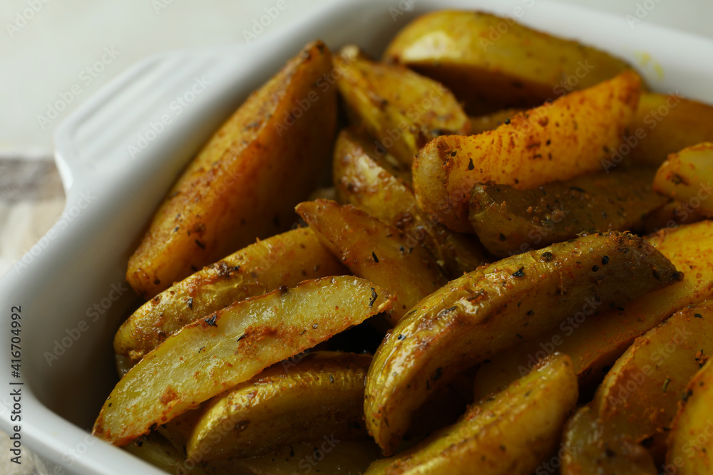 Bowl of tasty potato wedges, close up Bowl of tasty potato wedges, close up