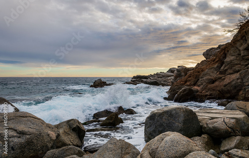 The rocky shore of Tossa de Mar,Costa Brava, Spain, at the foot of the medieval fortress.