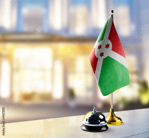 Burundi flag on the reception desk in the lobby of the hotel photo