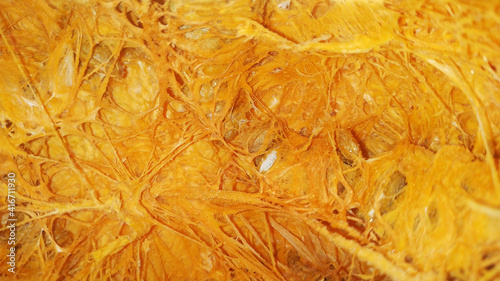 The texture of a pumpkin cut in half.